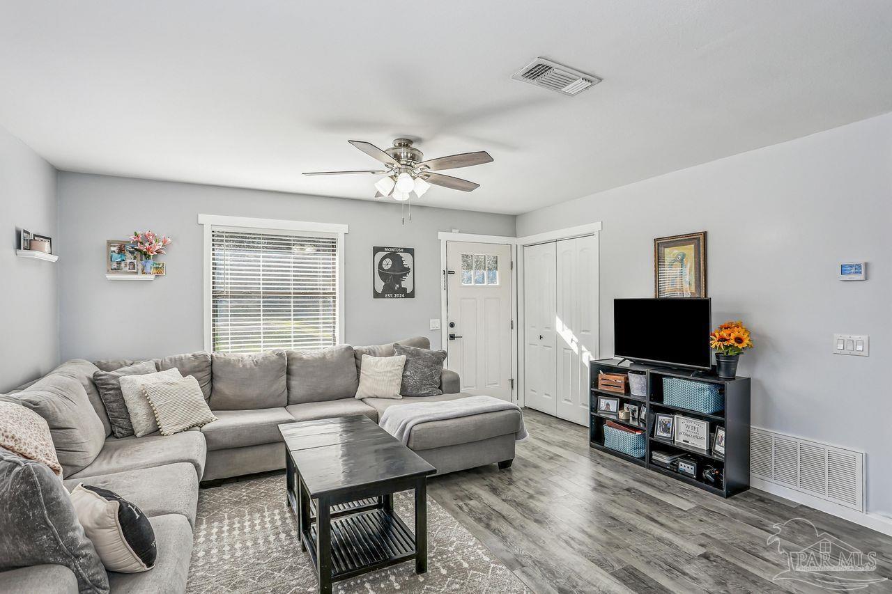 4010 Wyndham Road Century, FL 32535 - Photo 6 of 25 a living room with furniture and a flat screen tv