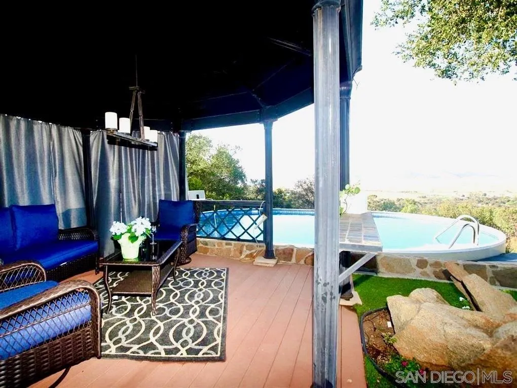 18259 Chablis Road Ramona, CA 92065 - Photo 4 of 24 a balcony with furniture and a potted plant
