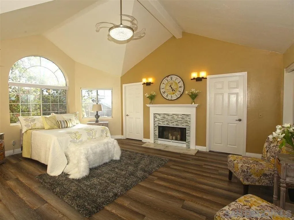 18259 Chablis Road Ramona, CA 92065 - Photo 8 of 24 a bed room with a bed and a fireplace