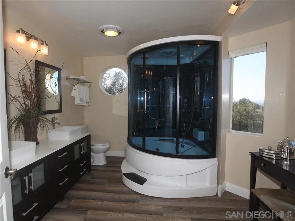 18259 Chablis Road Ramona, CA 92065 - Photo 9 of 24 a bathroom with a sink and a mirror