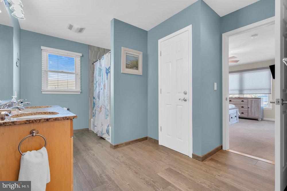 108 West 10th Street Ship Bottom, NJ 08008 - Photo 12 of 47 Serene bathroom with calming blue tones.