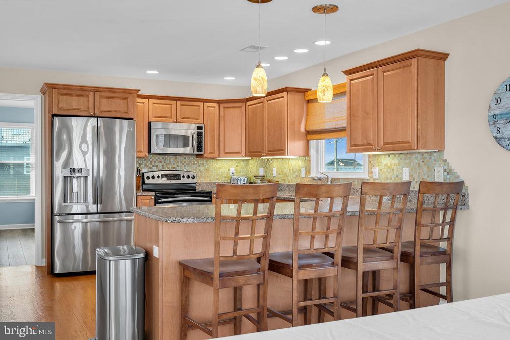 108 West 10th Street Ship Bottom, NJ 08008 - Photo 23 of 47 Modern kitchen with warm wood accents.
