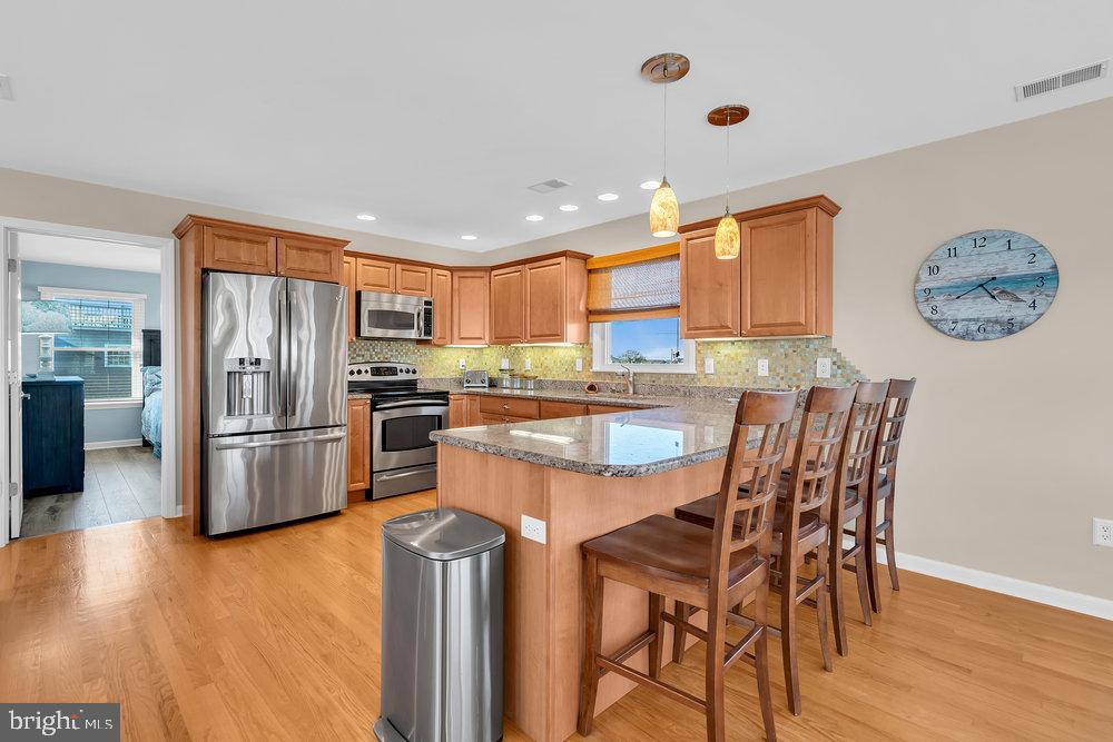 108 West 10th Street Ship Bottom, NJ 08008 - Photo 24 of 47 Modern kitchen with warm wood accents.