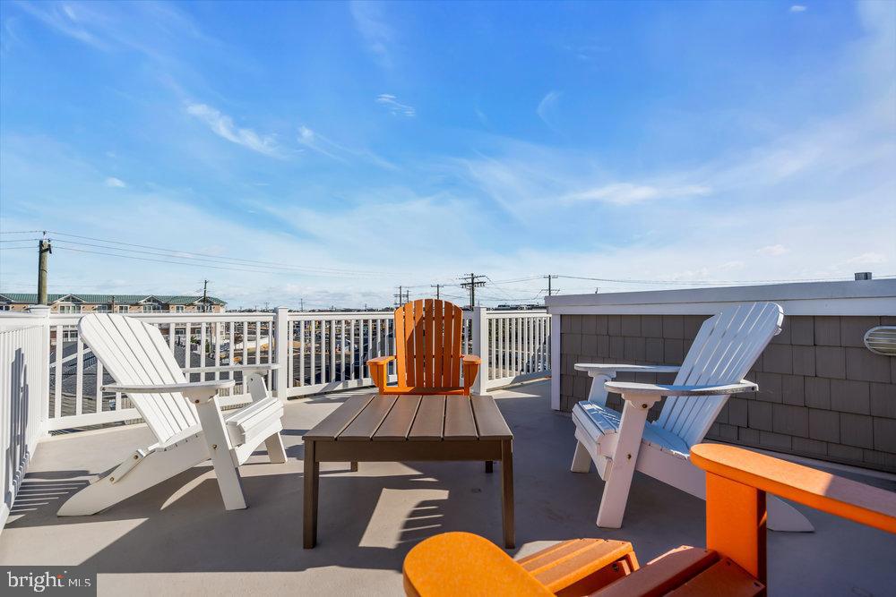 108 West 10th Street Ship Bottom, NJ 08008 - Photo 38 of 47 Sunny rooftop retreat with vibrant seating.