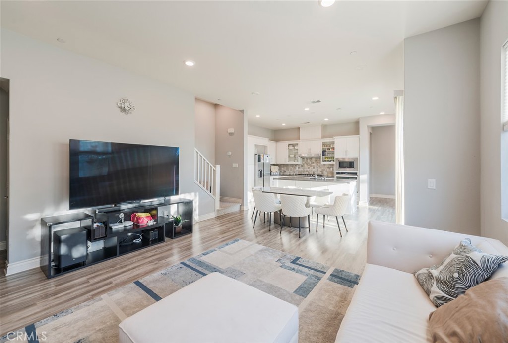 102 Spectacle Irvine, CA 92618 - Photo 13 of 40 a living room with furniture and a flat screen tv