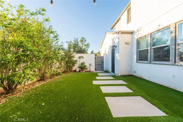 a view of yard with patio