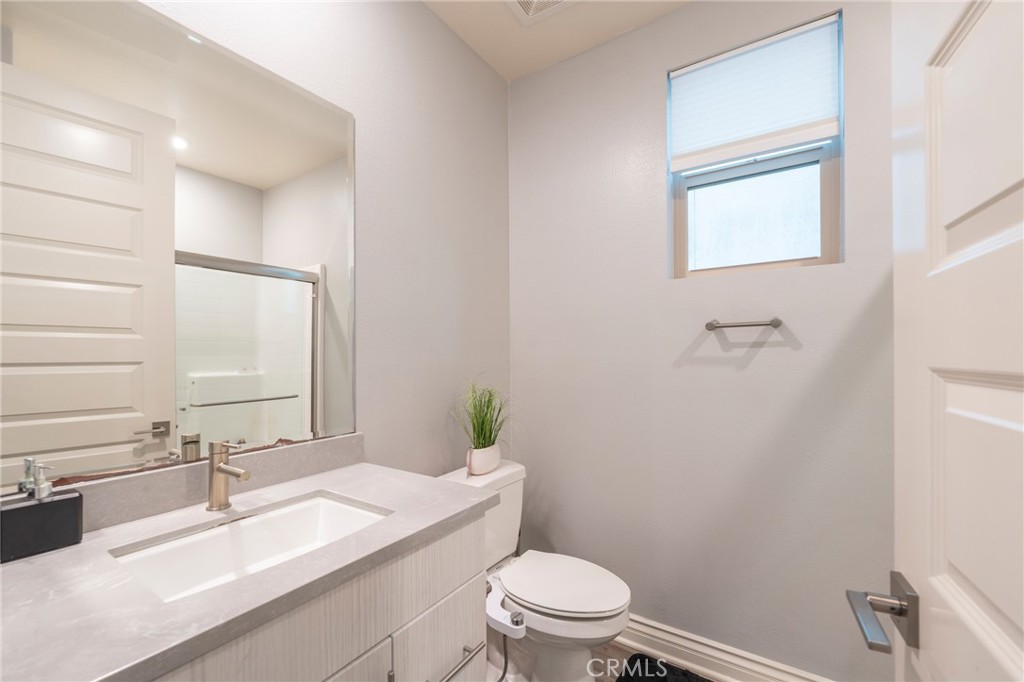 102 Spectacle Irvine, CA 92618 - Photo 20 of 40 a bathroom with a sink a toilet and shower