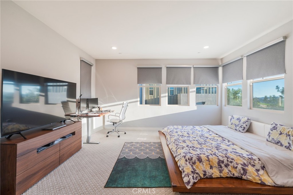 102 Spectacle Irvine, CA 92618 - Photo 22 of 40 a bedroom with a bed and window