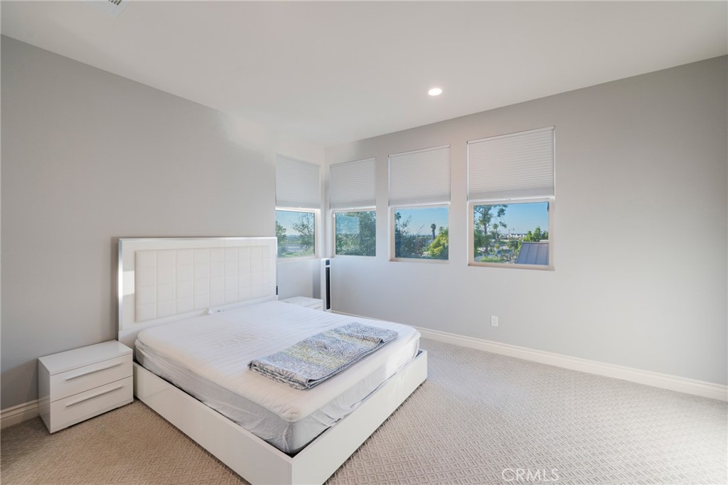 102 Spectacle Irvine, CA 92618 - Photo 26 of 40 a view of bedroom with furniture and window