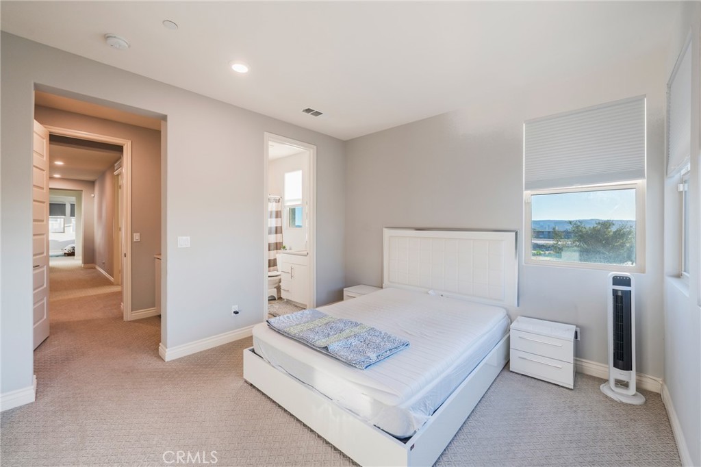 102 Spectacle Irvine, CA 92618 - Photo 27 of 40 a bedroom with a bed and a view of bathroom