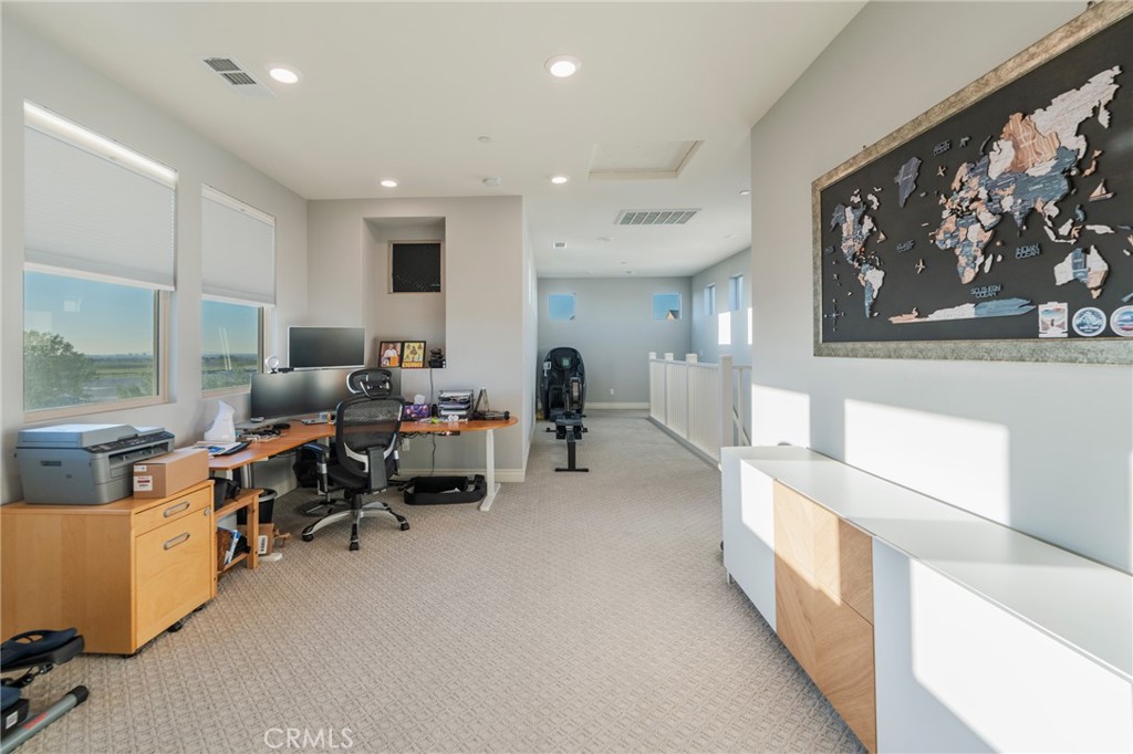 102 Spectacle Irvine, CA 92618 - Photo 30 of 40 a living room with furniture and a large window