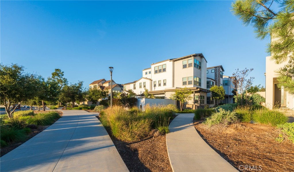 102 Spectacle Irvine, CA 92618 - Photo 3 of 40 a sign board with yard in front of it