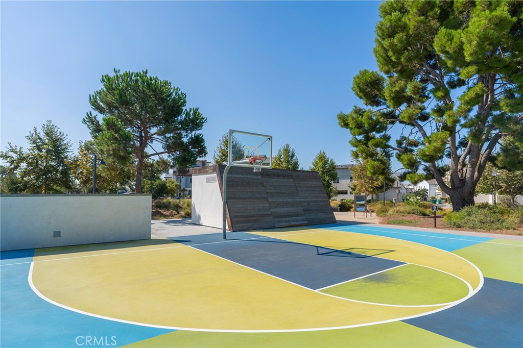 102 Spectacle Irvine, CA 92618 - Photo 36 of 40 a view of a swimming pool with an outdoor space and seating area