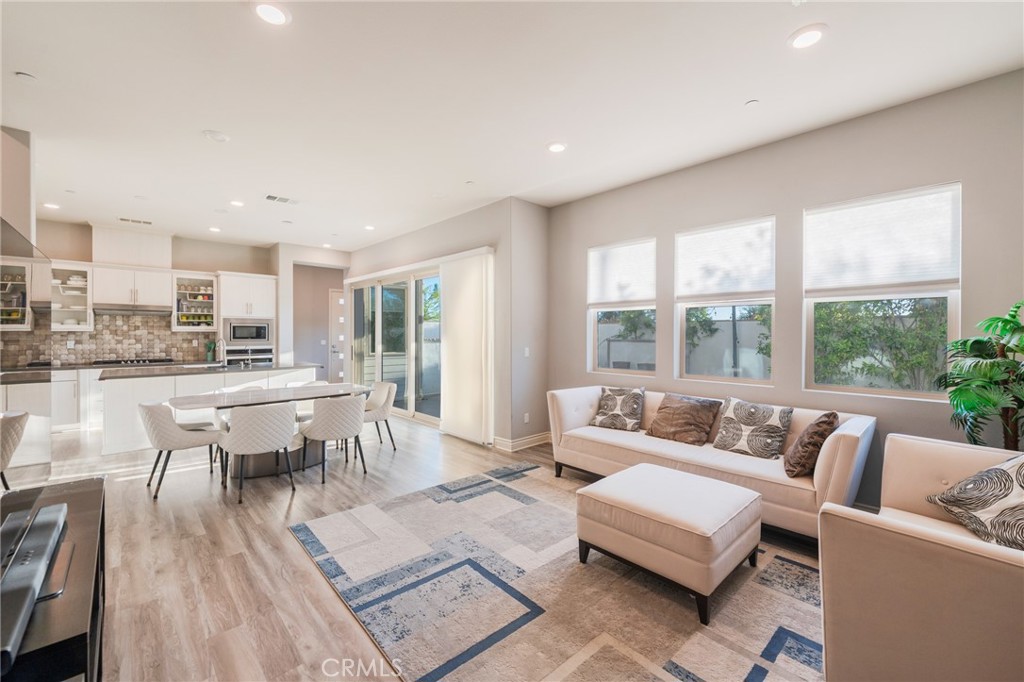 102 Spectacle Irvine, CA 92618 - Photo 6 of 40 a living room with furniture and a table