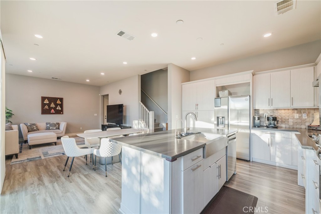 102 Spectacle Irvine, CA 92618 - Photo 8 of 40 a large white kitchen with a large window