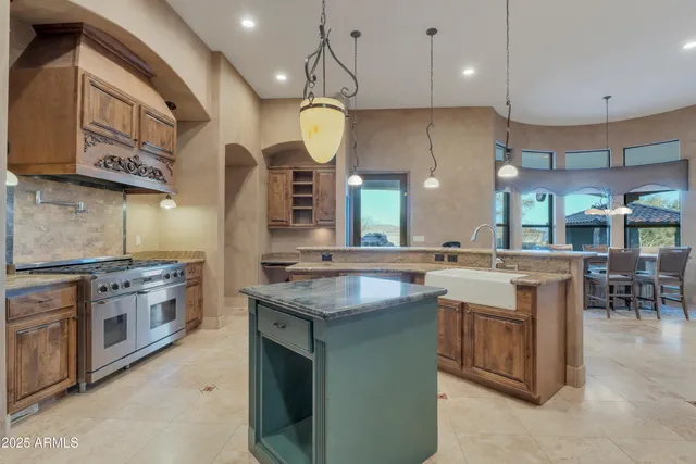 a kitchen with stainless steel appliances granite countertop a sink and a microwave