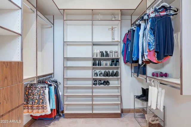 a bathroom with a granite countertop toilet a mirror and a sink