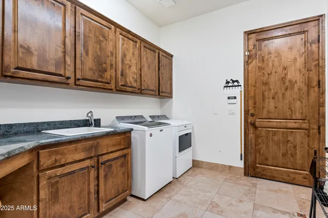 a view of a swimming pool with a lounge chair and palm trees