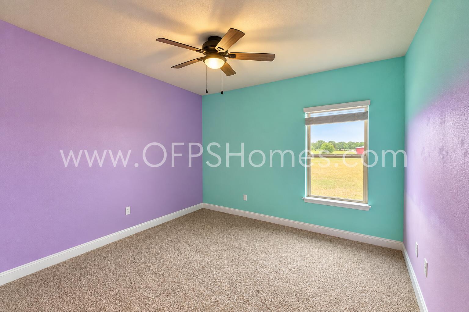 3445 Brownstone Road Crestview, FL 32539 - Photo 15 of 21 Bright Empty Bedroom with Warm Fan Light