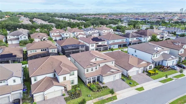 an aerial view of residential houses with outdoor space