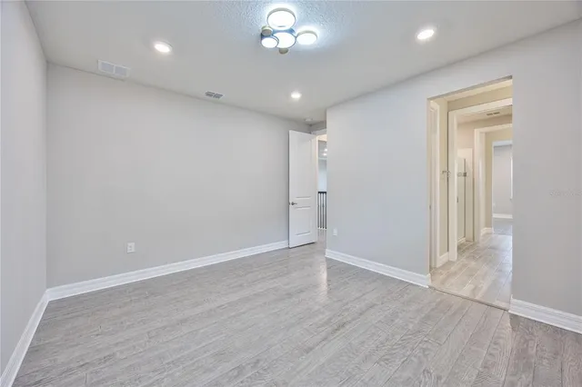 a bathroom with a sink vanity granite and a mirror