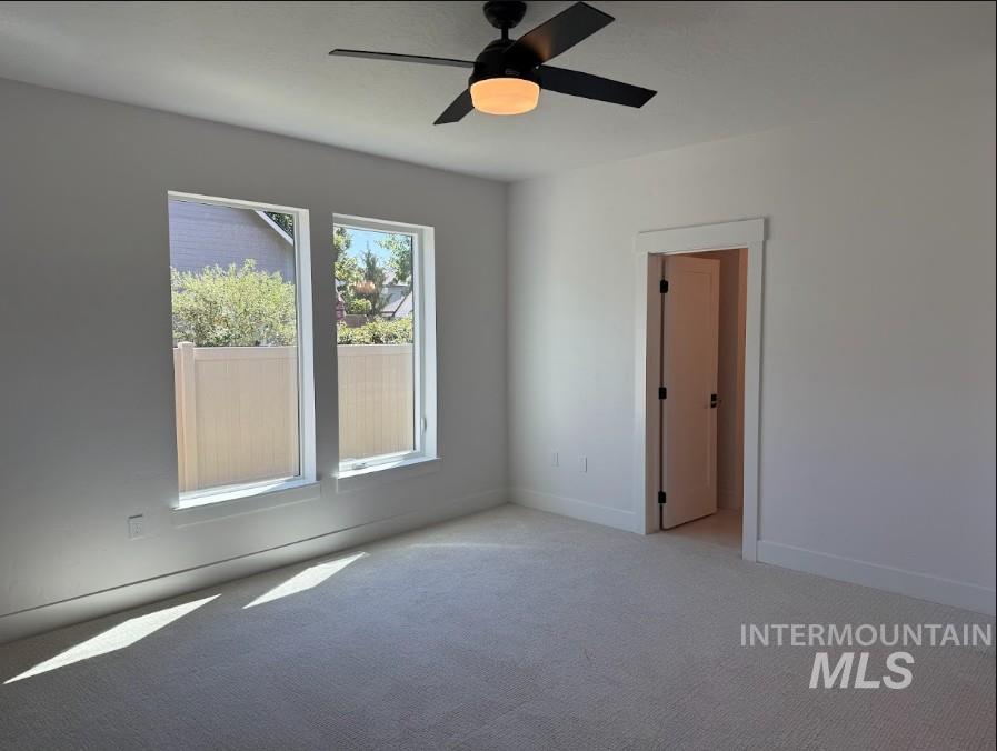 755 West Wrangler Street Meridian, ID 83646 - Photo 26 of 35 Spacious room with plush carpeting and a modern ceiling fan