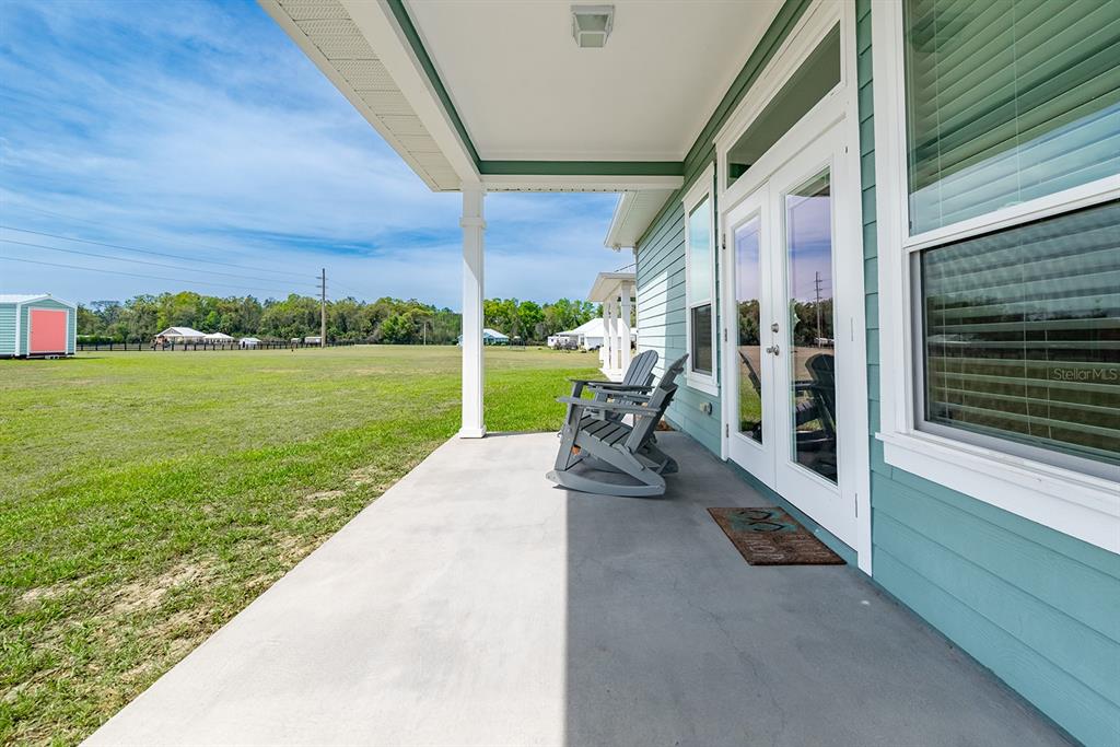 6095 Southwest 82nd Place Trenton, FL 32693 - Photo 15 of 44 a view of a house with backyard and porch