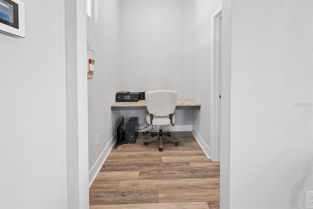 6095 Southwest 82nd Place Trenton, FL 32693 - Photo 17 of 44 a view of a room with wooden floor and bench
