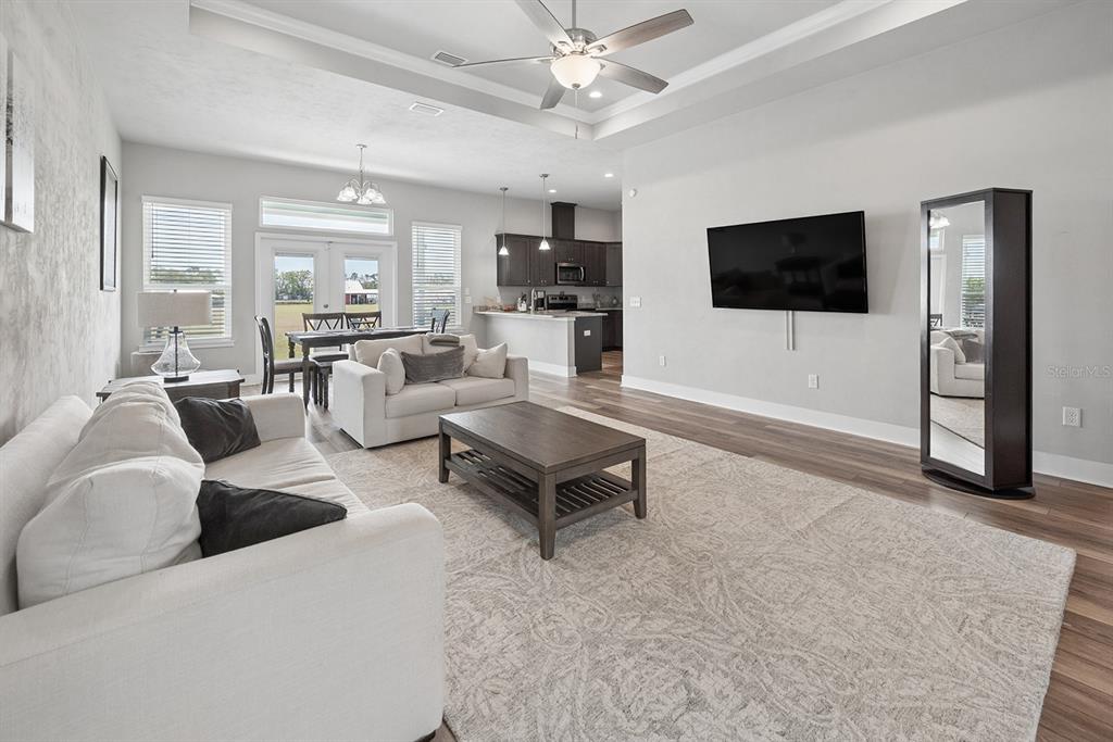 6095 Southwest 82nd Place Trenton, FL 32693 - Photo 18 of 44 a living room with furniture and a flat screen tv