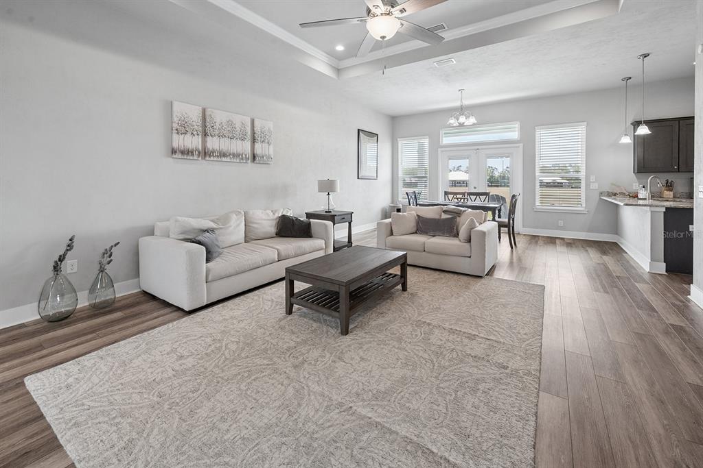 6095 Southwest 82nd Place Trenton, FL 32693 - Photo 19 of 44 a living room with furniture and a view of kitchen