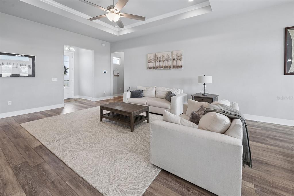 6095 Southwest 82nd Place Trenton, FL 32693 - Photo 20 of 44 a living room with furniture and a wooden floor