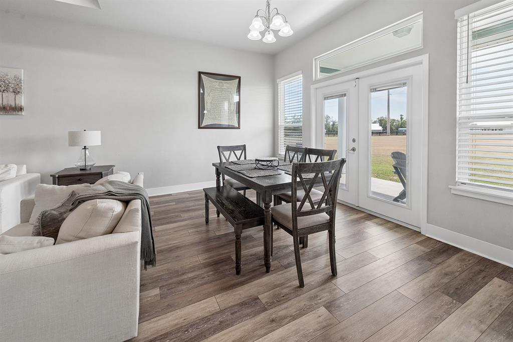 6095 Southwest 82nd Place Trenton, FL 32693 - Photo 21 of 44 a living room with furniture and wooden floor
