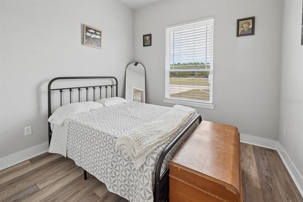 6095 Southwest 82nd Place Trenton, FL 32693 - Photo 27 of 44 a bedroom with a bed and a window