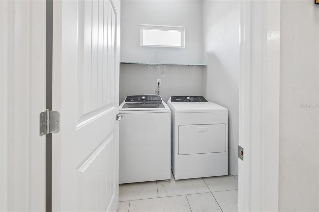6095 Southwest 82nd Place Trenton, FL 32693 - Photo 31 of 44 a utility room with dryer and washer
