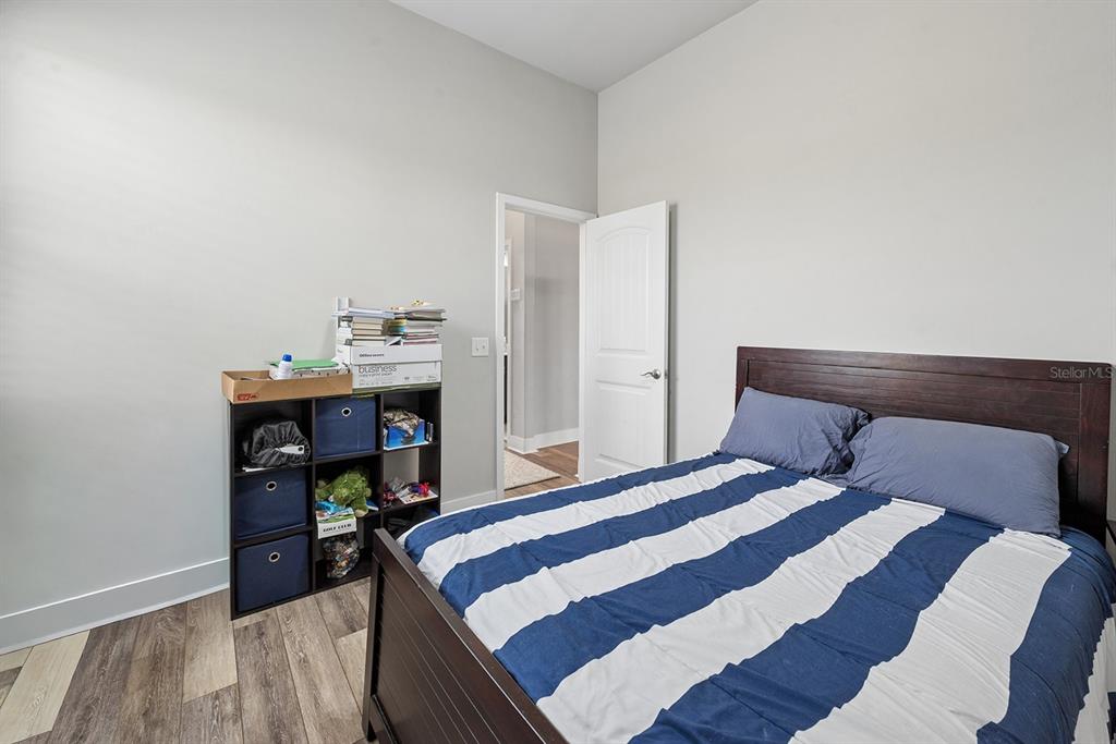 6095 Southwest 82nd Place Trenton, FL 32693 - Photo 33 of 44 a bedroom with a bed and a table in it