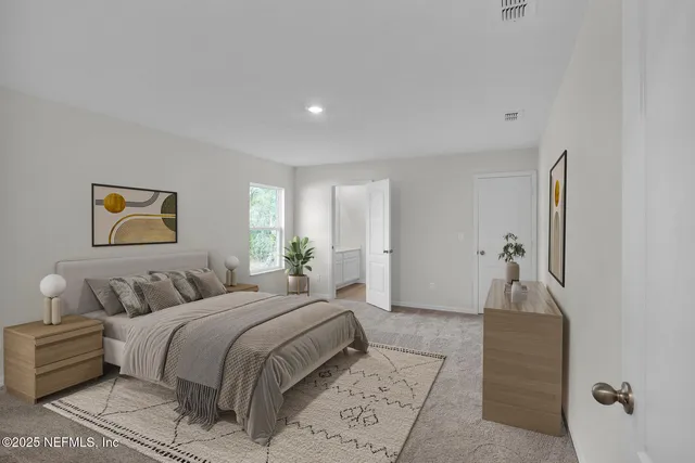 a bedroom with a bed and a couch