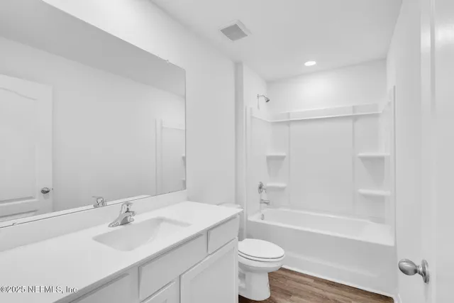 a bathroom with a sink toilet and bathtub