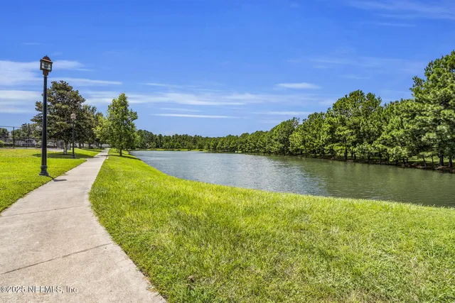 a view of a lake with a big yard