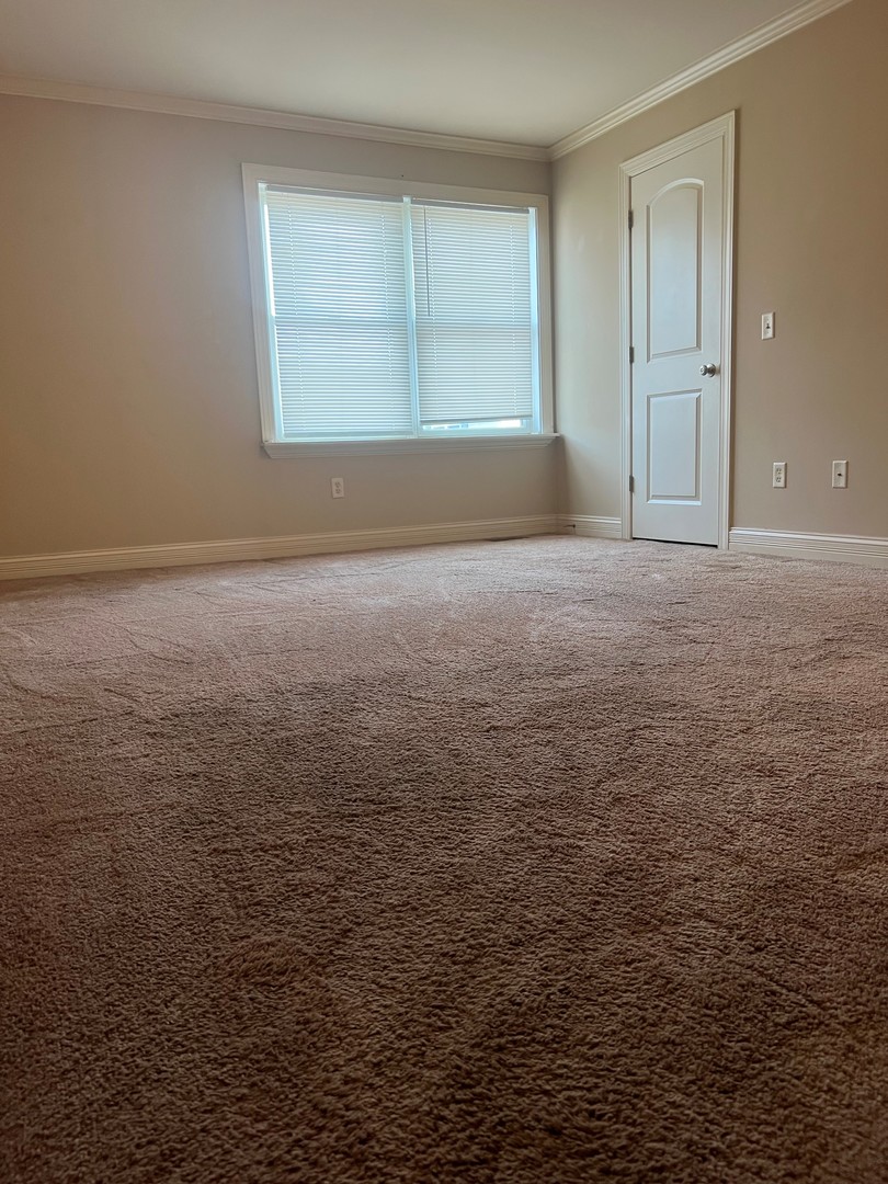 412 North Grainger Lane Cortland, IL 60112 - Photo 7 of 9 an empty room with a window