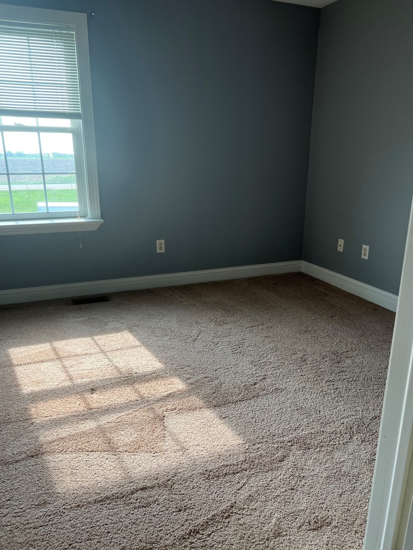 412 North Grainger Lane Cortland, IL 60112 - Photo 8 of 9 a view of an empty room with a window