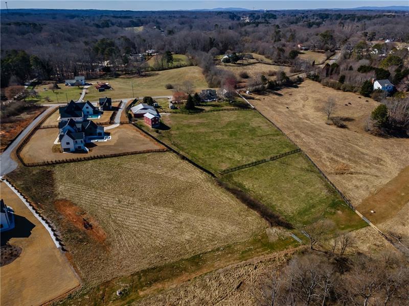 5170 Howard Road Cumming, GA 30040 - Photo 14 of 18 an aerial view of a house with a swimming pool
