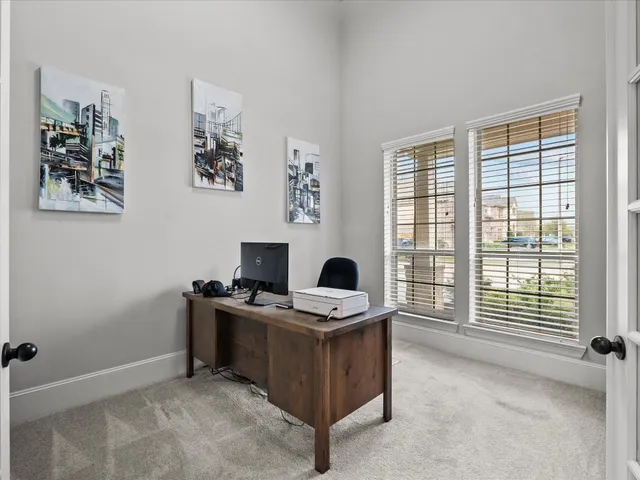 a view of workspace with furniture and window
