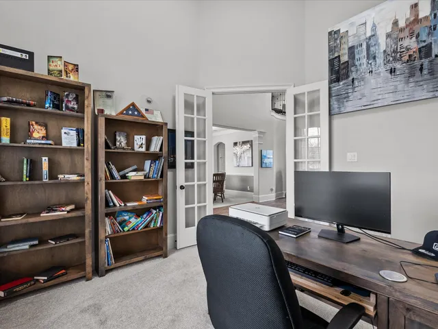 a workspace with furniture and bookshelf