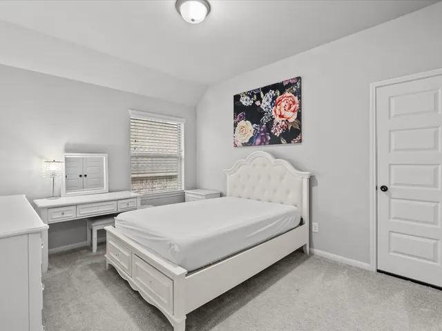 a bed room with a bed and a table