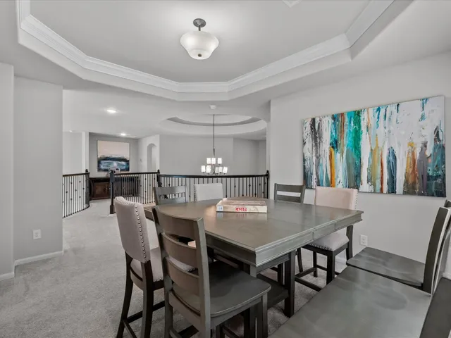 a dining room with furniture and window