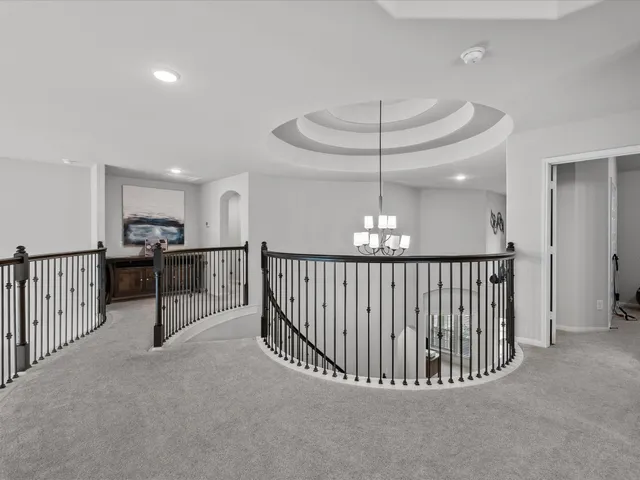 a view of a hallway with seating area