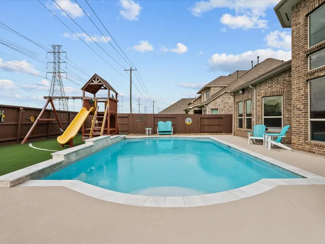 a view of a house with swimming pool