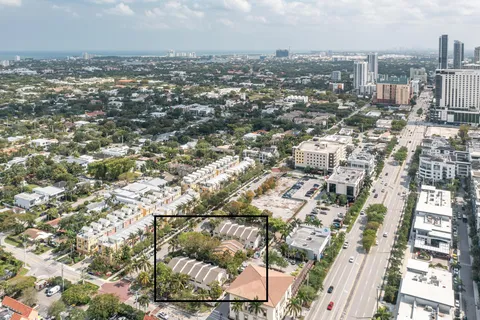 an aerial view of residential building with parking space