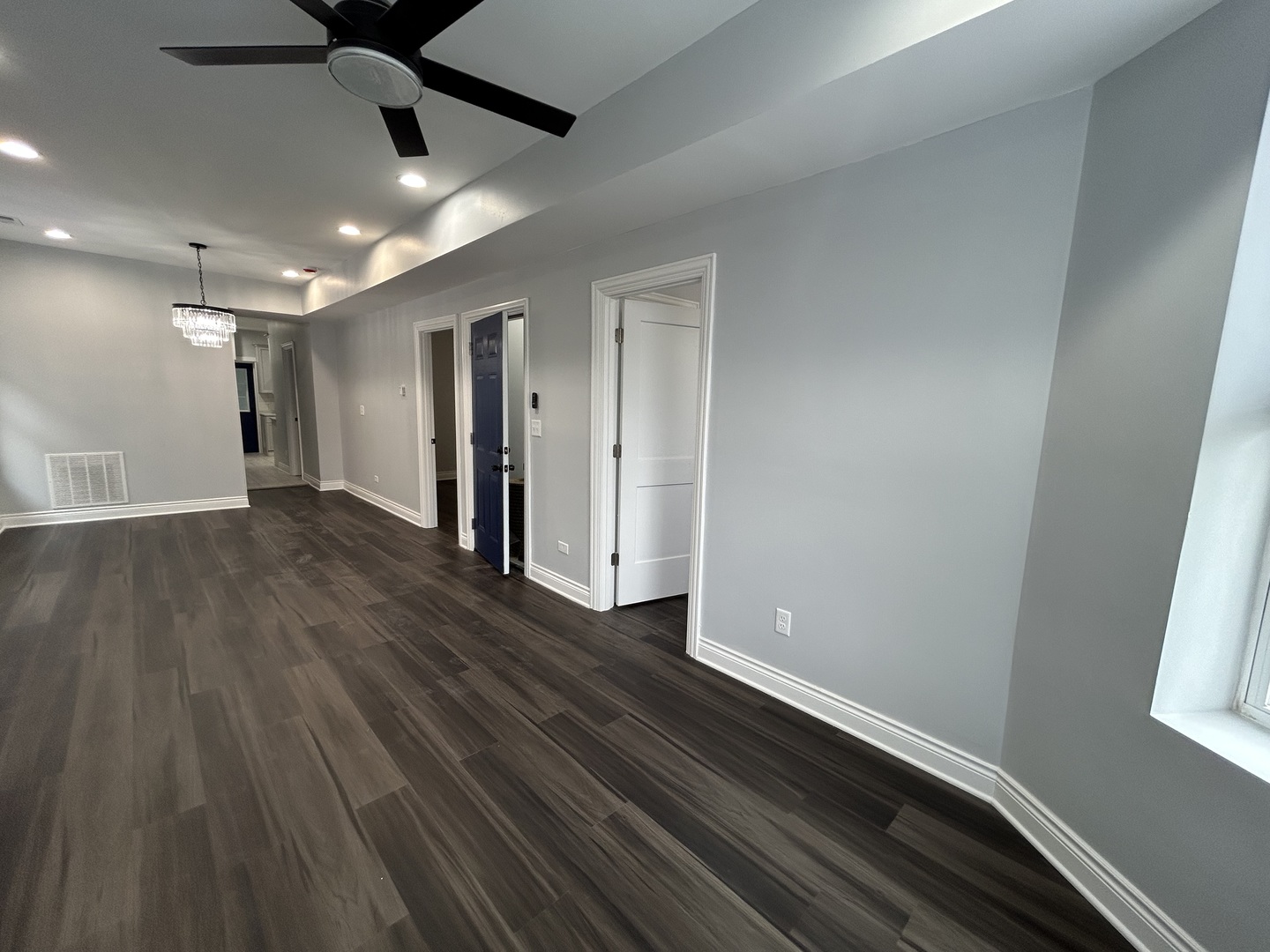 7940 South Carpenter Street, Unit 2 Chicago, IL 60620 - Photo 16 of 34 wooden floor in an empty room with a window