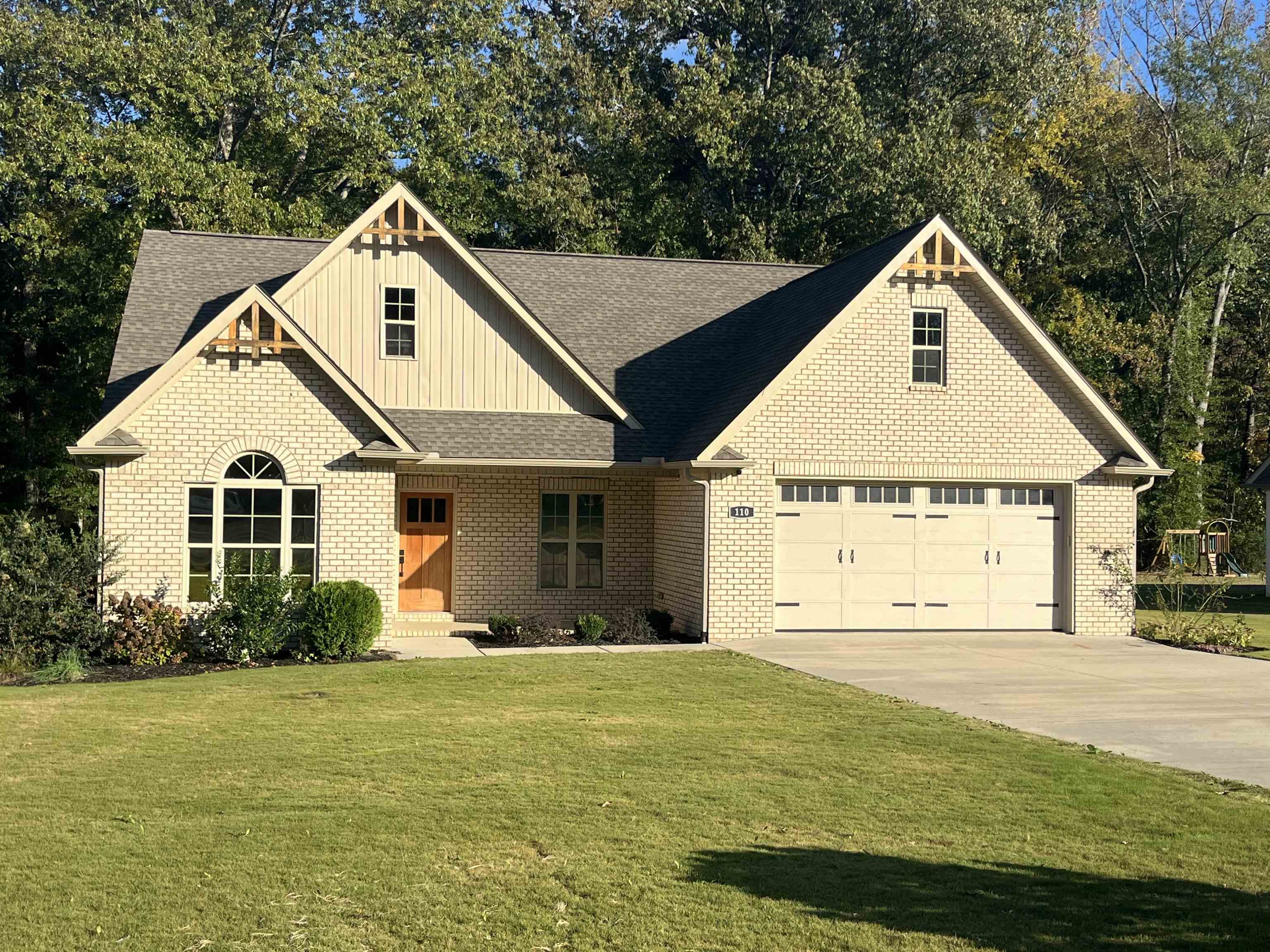 110 RB Drive Savannah, TN 38372 - Photo 1 of 18 a view of a white house with yard and plants